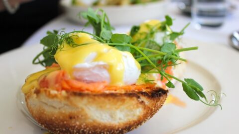 Savour a gourmet eggs Benedict with creamy hollandaise and fresh greens at our elegant hotel restaurant.