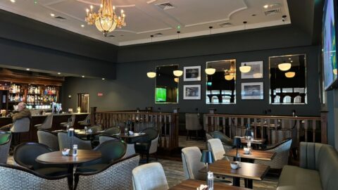 Elegant hotel bar lounge with plush seating, ambient lighting, and a well-stocked bar, perfect for relaxation and socialising.